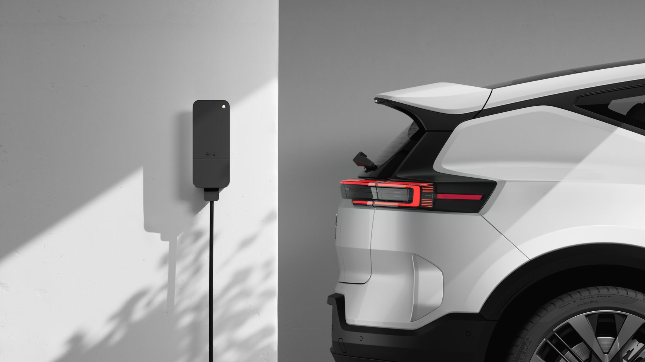EV charger on wall next to a Polestar