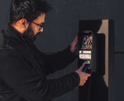 Electrician installing amina EV charger, connecting wiring for a safe, compliant, reliable setup