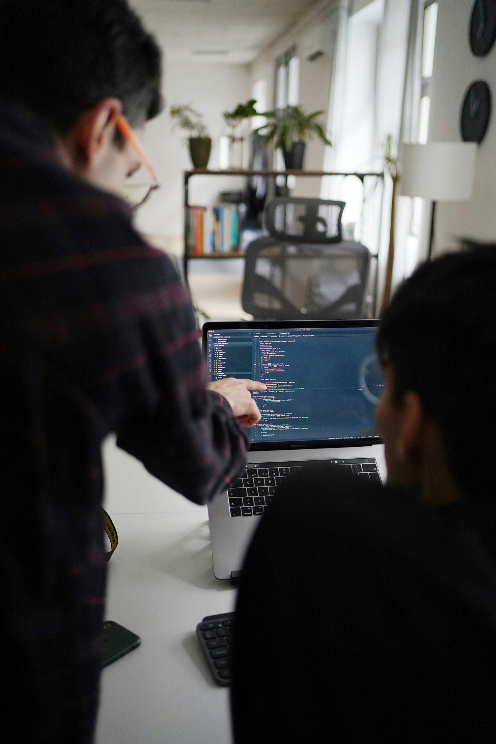 Software team reviewing EV charger backend code to support CPMS integrations and reliable scaling